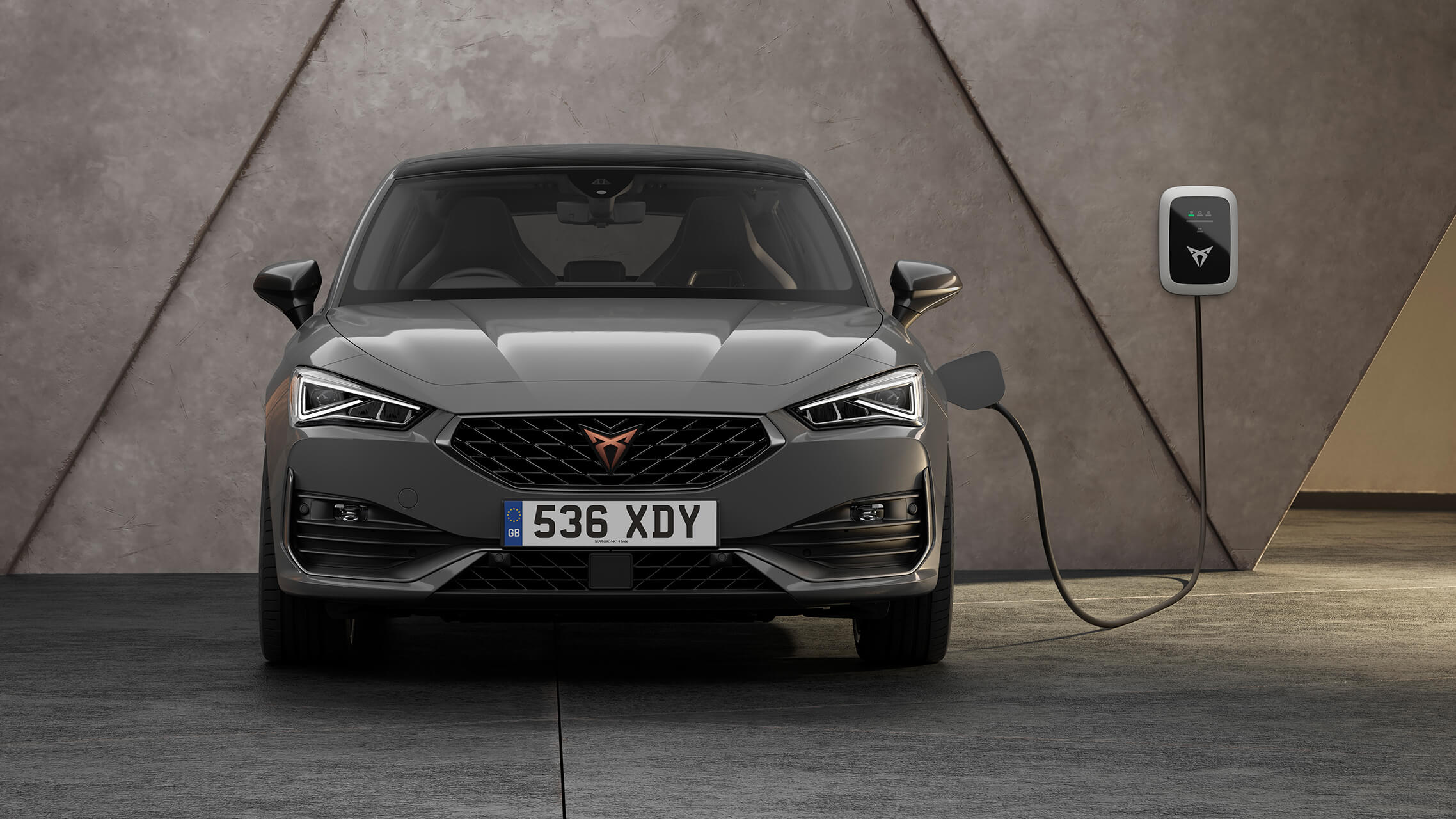 CUPRA Leon ehybrid magnetic tech matte compact sports car front view charging